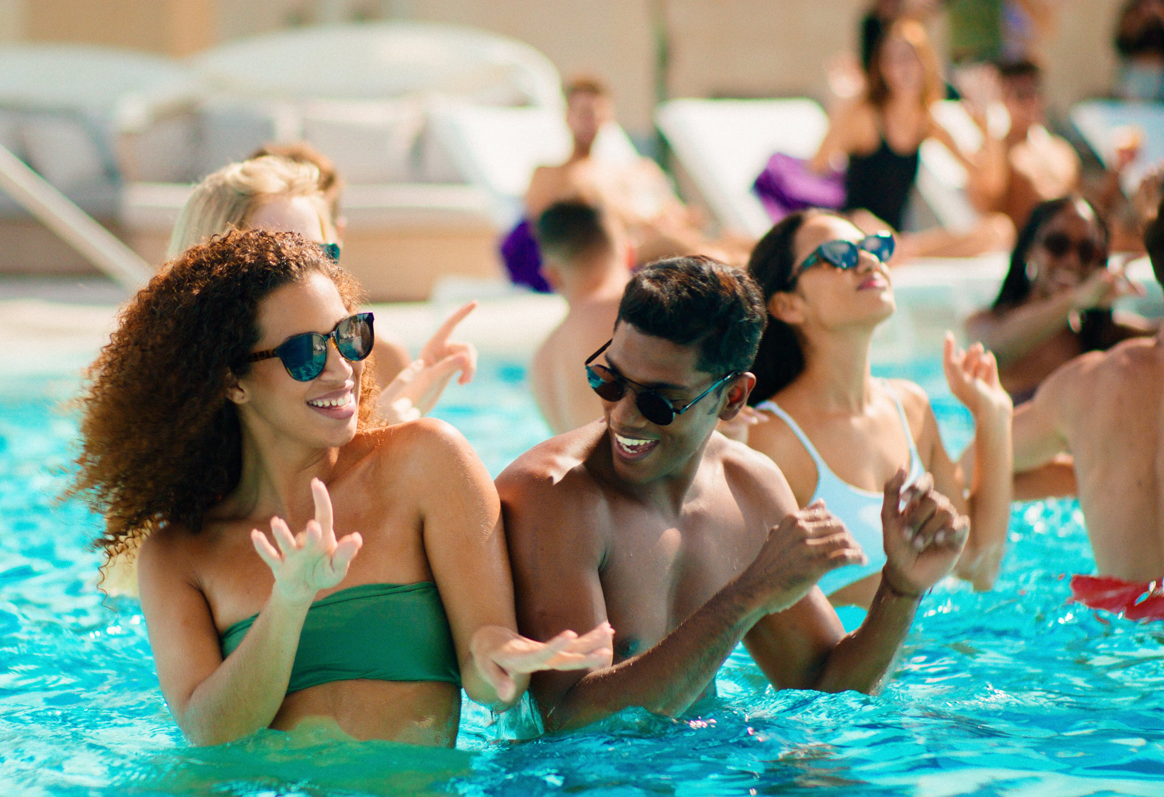 Adults partying in pool