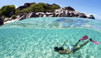 Girl snorkeling in ocean