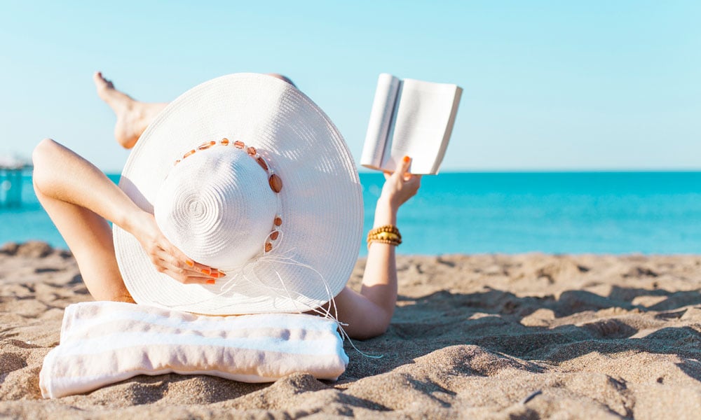 Woman reading at the beach